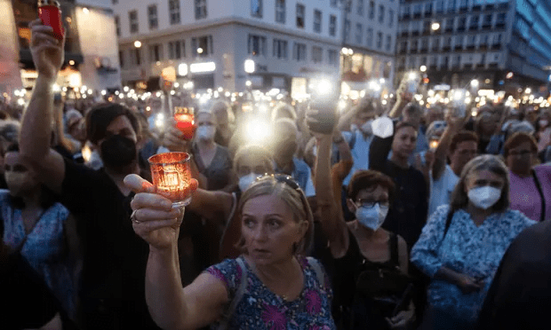 People attend a candlelight vigil in Vienna in memory of Lisa-Maria Kellermayr. Photograph: Alex Halada/AFP/Getty Images