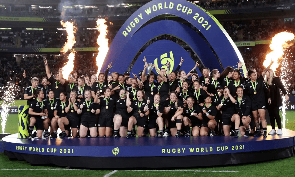 New Zealand celebrate winning the Women's World Cup with the trophy. Photograph: David Rowland/Reuters